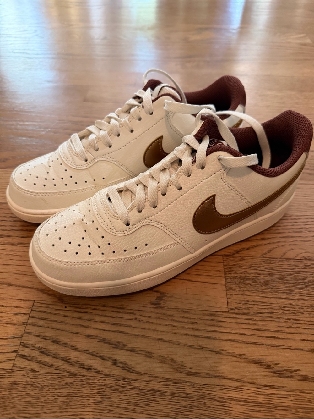 Nike Women’s White Leather Sneakers with Brown Swoosh